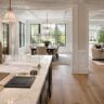 Open-concept whole house remodel with kitchen, dining, living space, material samples, floor plan, and measuring tape on a marble island.